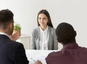 A specialist in a structured interview with a two-person panel